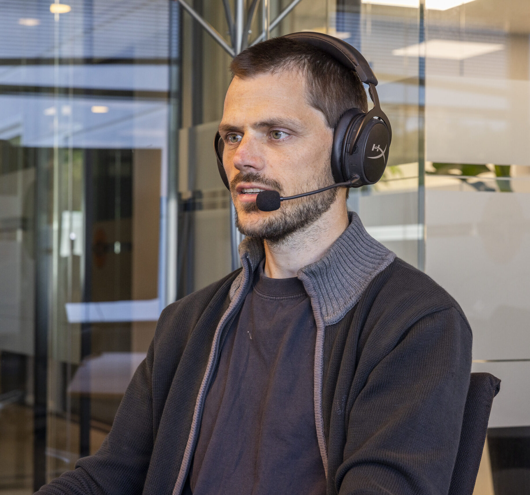 A WISE Group support engineer wearing a headset